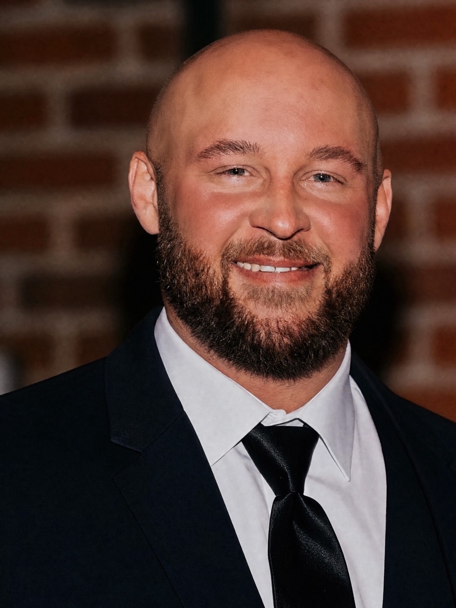 Hunter today, healthy and smiling in a suit